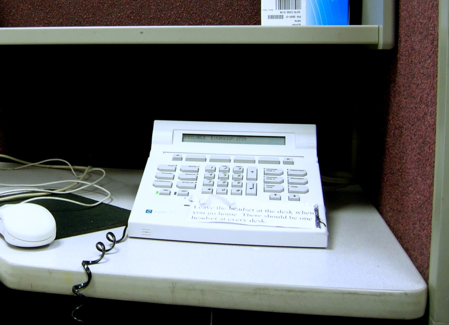 A call-center operator wearing a headset, the kind of station that handles 57% of Philadelphia 311 activity.