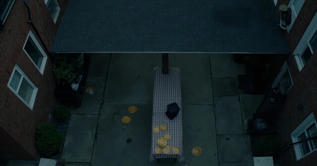 Aerial view of a Philadelphia block party with folding table down the street between row houses.